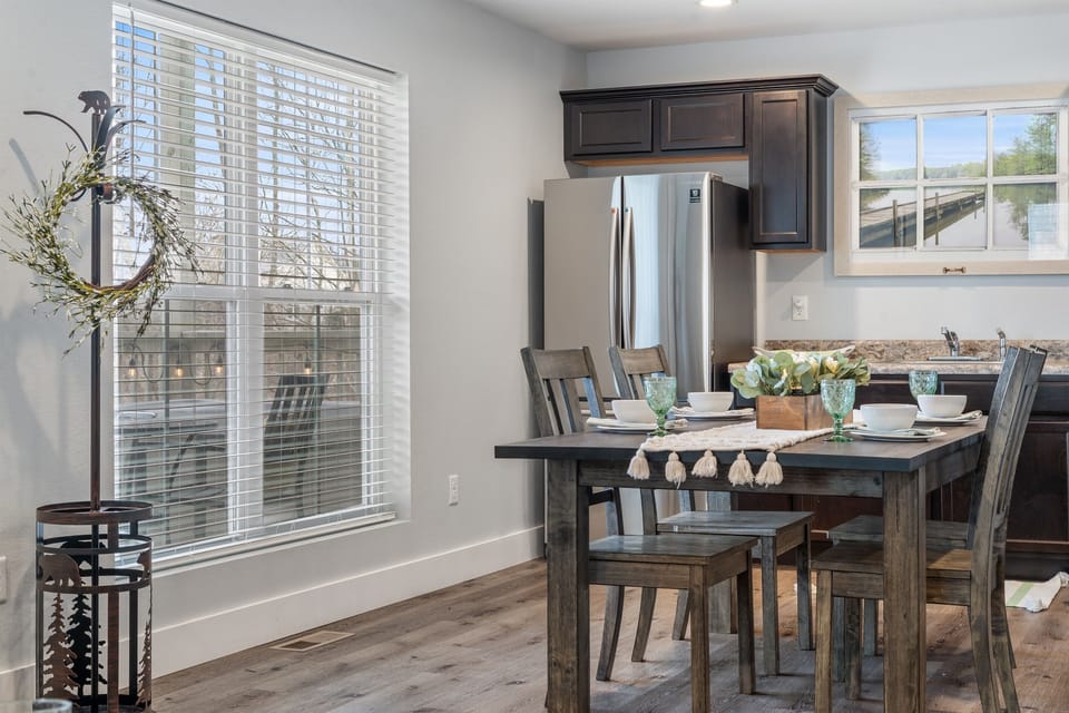 Gather comfortably around the dining table with space for shared meals, games, or planning the day. Located right off the kitchen, this area keeps everyone connected whether you’re cooking, eating, or relaxing.”