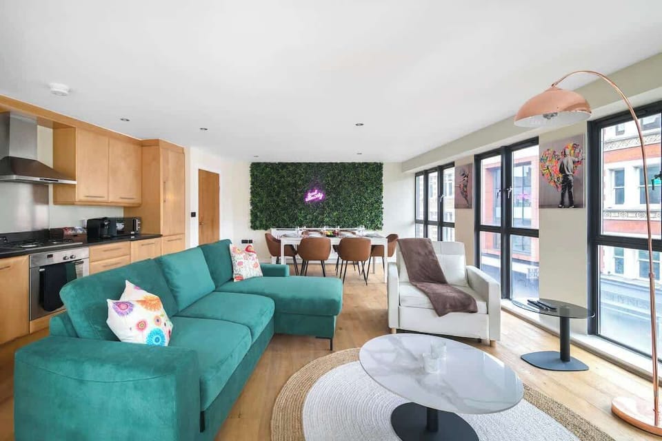 Relax together in this open-plan living space with TV and kitchen