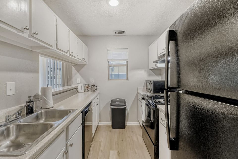 Sleek galley kitchen with modern finishes and efficient design.