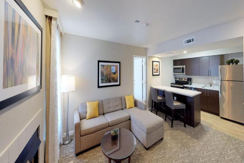 Sip coffee by the breakfast bar after a cozy night in.