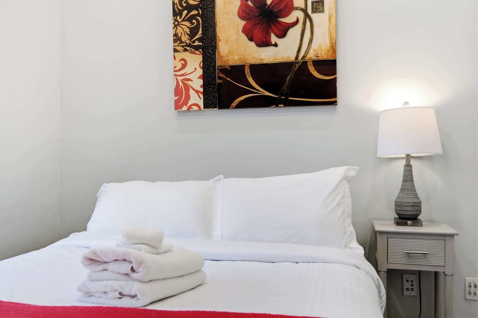 Bedroom 2: Relax and recharge in this peaceful bedroom featuring a plush double bed.