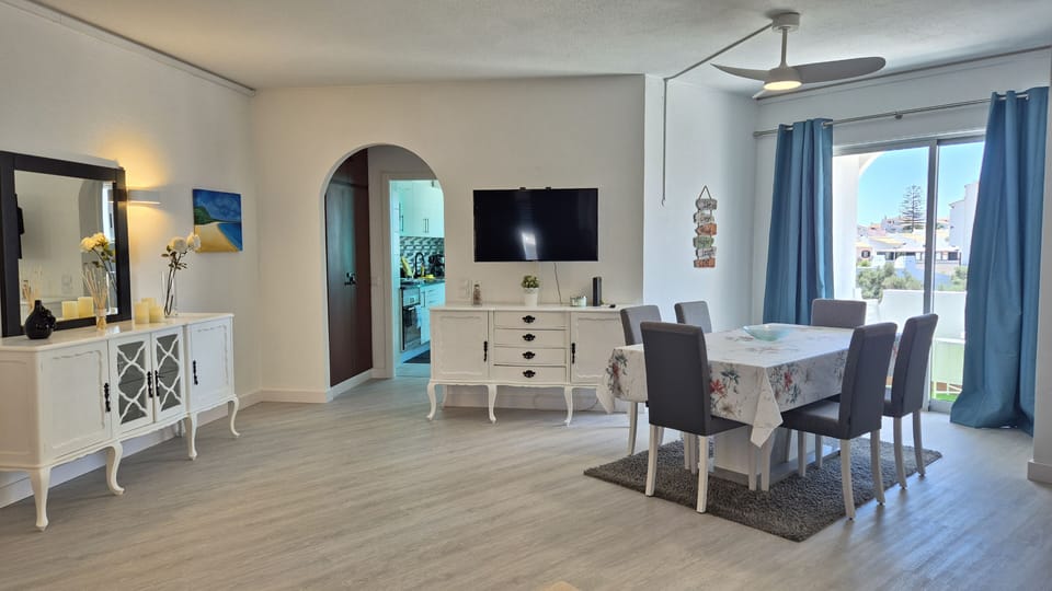 Spacious open plan living and dining room leading to balcony
