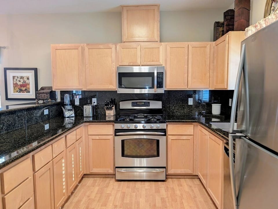 Kitchen includes silverware, drip coffee maker, pots and pans, baking dishes, and more