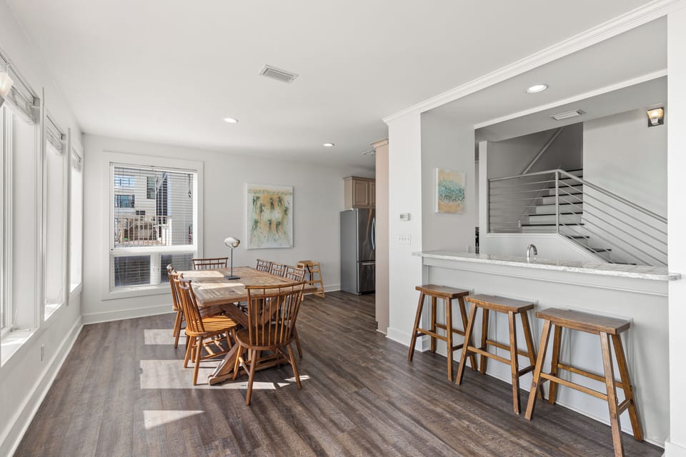 Gather around the spacious kitchen island or enjoy meals in your bright dining nook with natural light streaming through large windows.