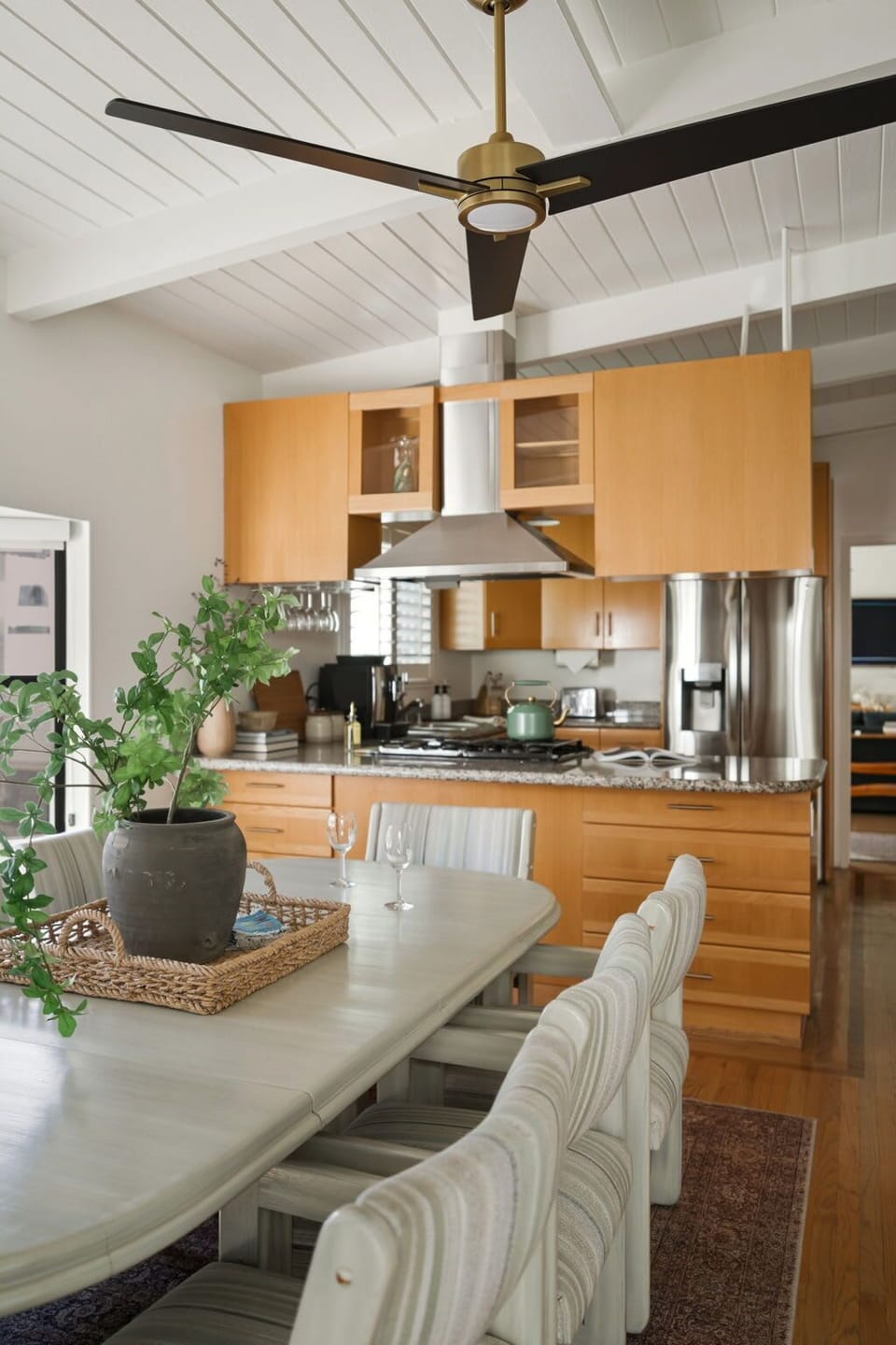 This open dining and kitchen layout creates an effortless flow, ideal for gathering and entertaining.