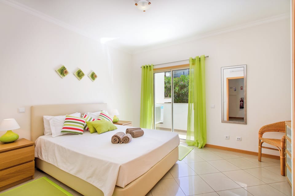 Stylish master bedroom with balcony
