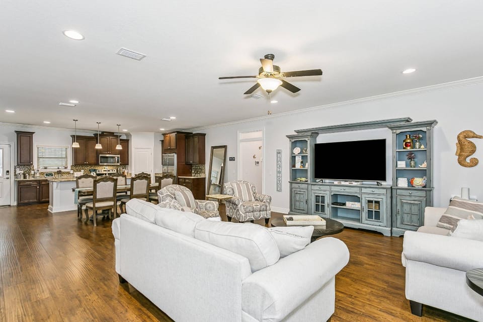 Large open concept living room, dining, and kitchen