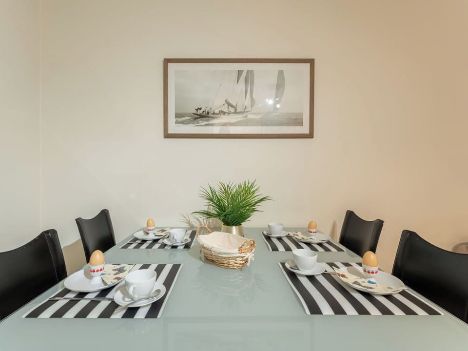 Furniture, Interior Design, Table, Tableware, Textile, Kitchen & Dining Room Table, Chair, Room, Dining Room, Lighting