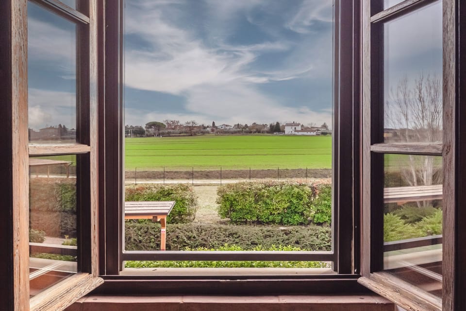 View from the bedroom windows overlooking the countryside and open green landsca