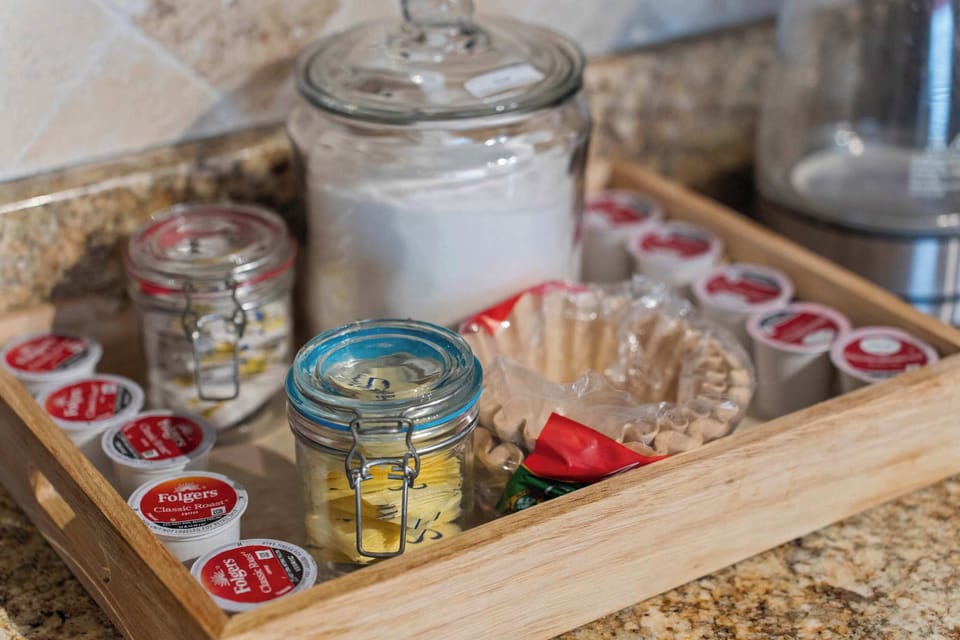 Coffee station with assorted pods and filters for a convenient start to your day.