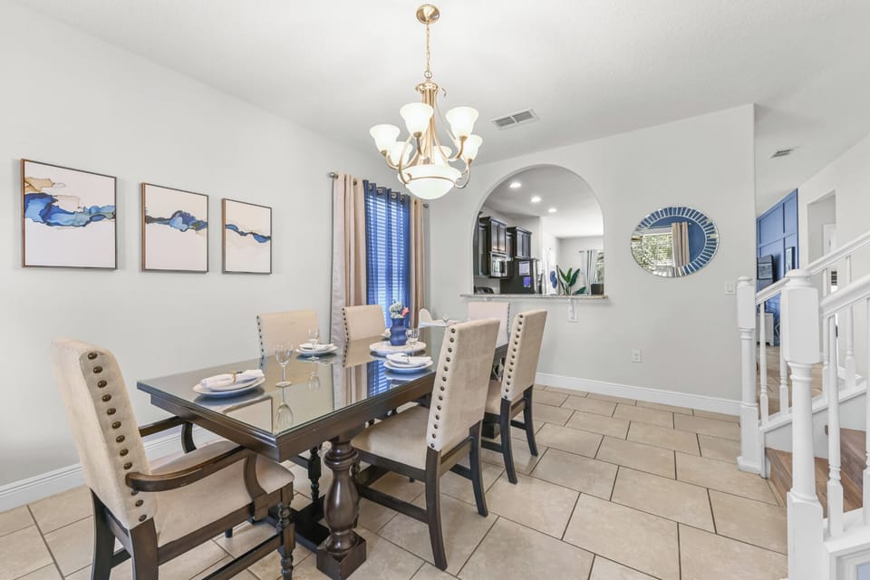 DINING ROOM:  Dining Room with 6-Seat Dining Table adjacent to Foyer and Stairwell to 2nd Floor