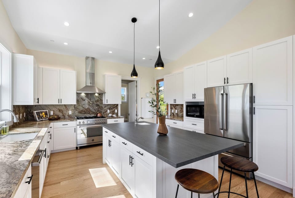 Large, professional kitchen is fully stocked.