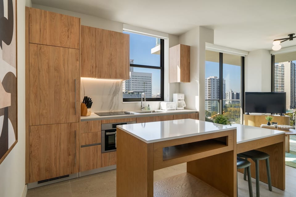 Modern kitchen with island seating and warm wood finishes
