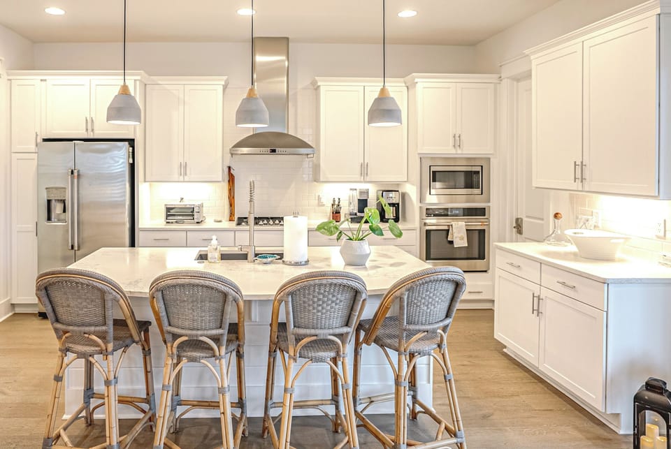 Bright, modern kitchen with stainless appliances & bar seating
