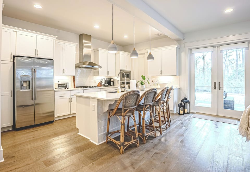 Fully stocked chef’s kitchen with oversized island seating