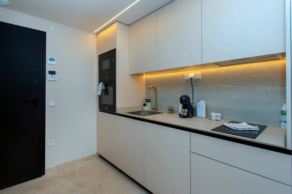 A chef’s sanctuary designed for every culinary desire. From gourmet preparations to effortless morning coffee, this fully equipped kitchen blends high-end functionality with sleek, modern design. Culinary excellence, redefined.
