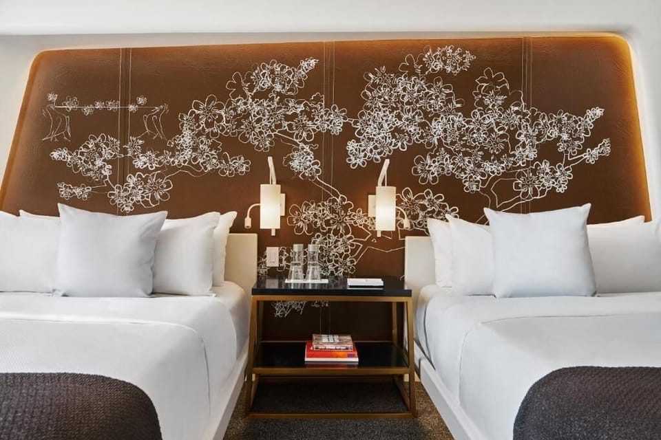 Sink into plush pillows with elegant lighting and calming wall art.