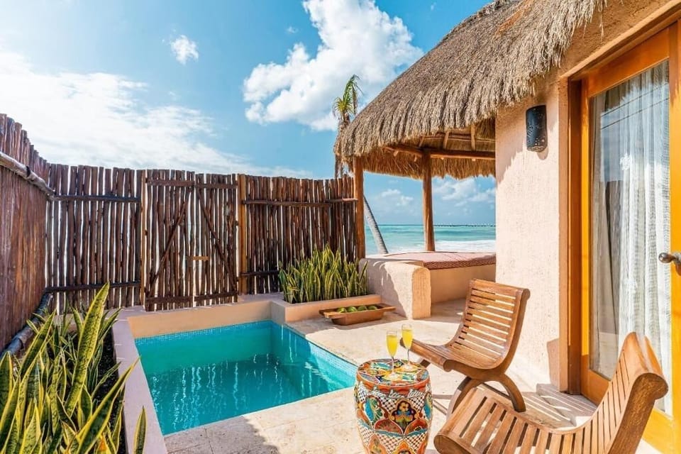 Dip into your private plunge pool under warm coastal sun.