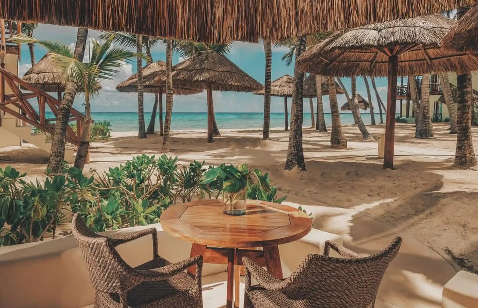 Soak up sea breezes under palapas with front-row beach views.