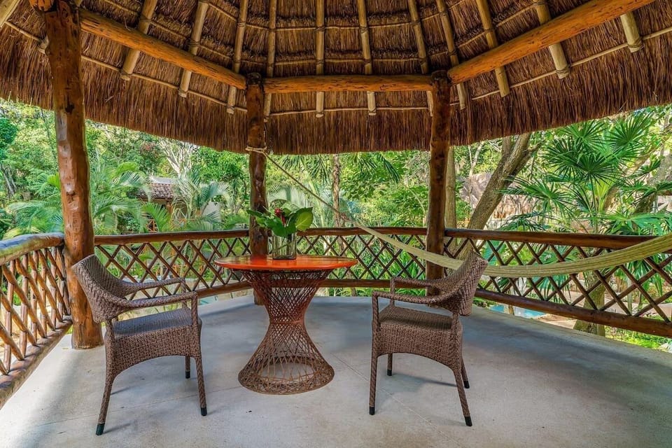 Sip morning coffee surrounded by palms on the shaded terrace.
