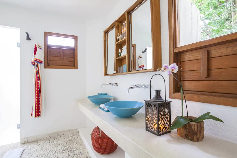 Refresh at the double vanity with spa-like artisan basins.