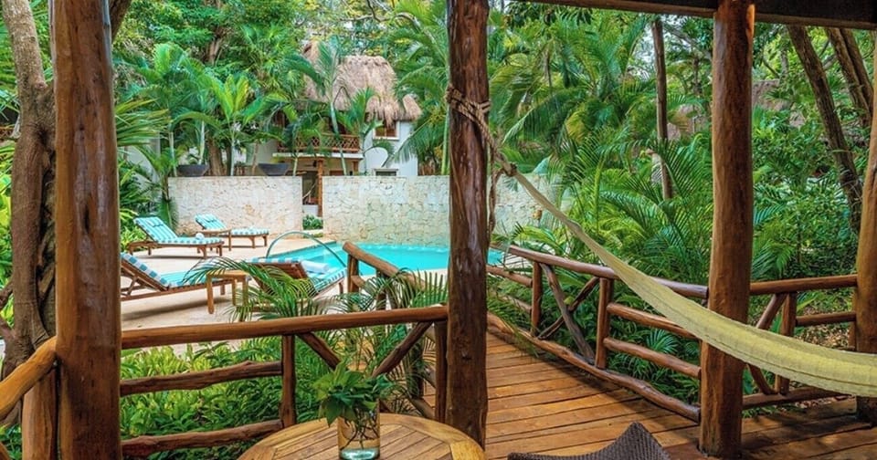 Lounge in the hammock while the pool glimmers below.
