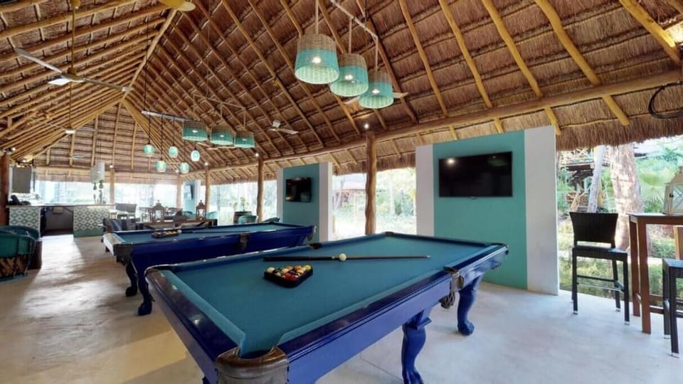 Challenge friends to a lively pool match in open-air style.