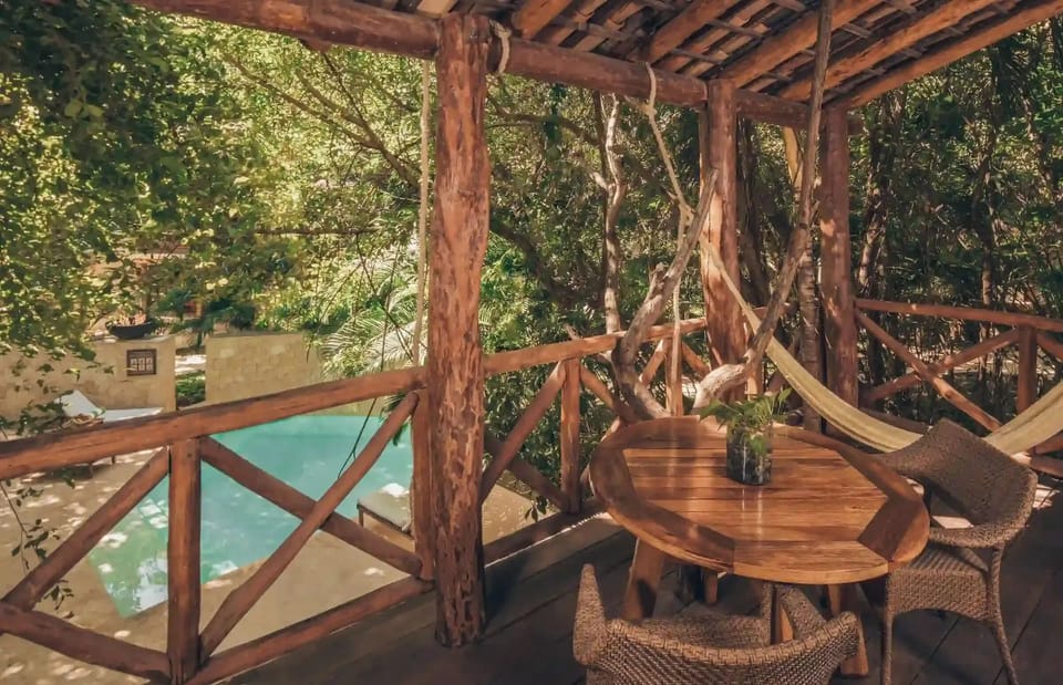 Sip coffee on the balcony overlooking the tranquil pool.