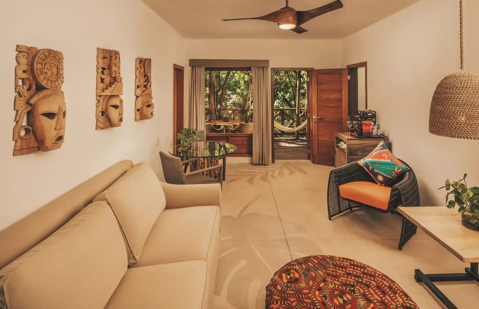 Lounge comfortably as jungle breezes drift through open doors.