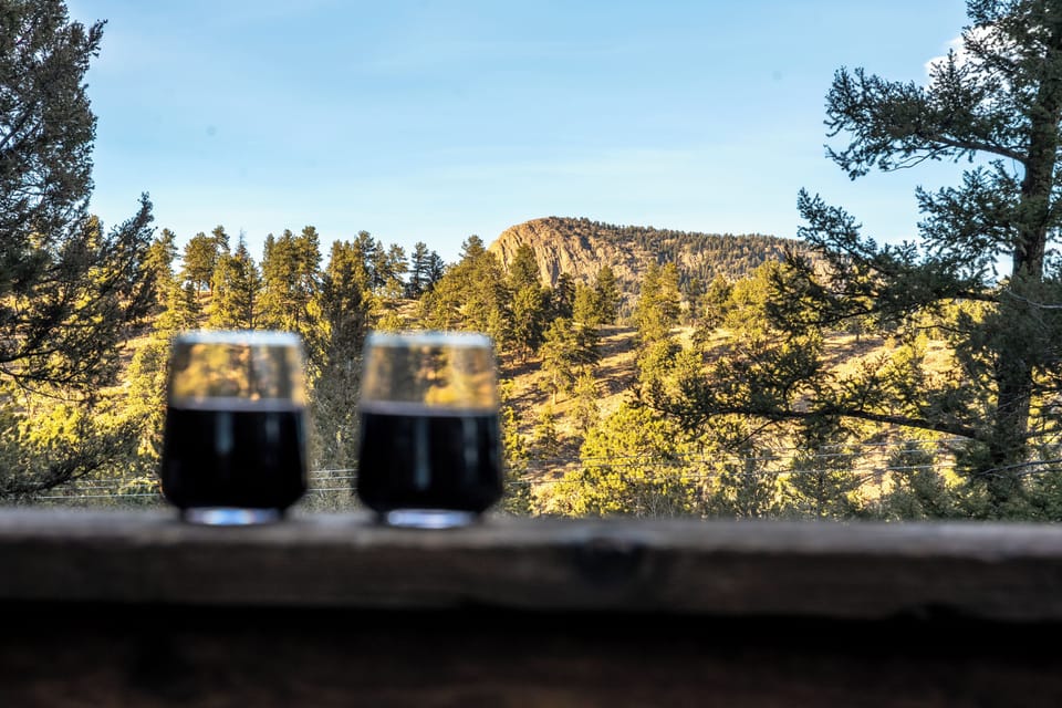 🥂🌄 Sip and savor the view—peaceful mountain scenery, pine-filled horizons, and the perfect perch for morning coffee or sunset wine 🌲✨