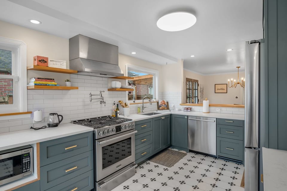 Fully equipped kitchen with modern appliances and ample prep space.