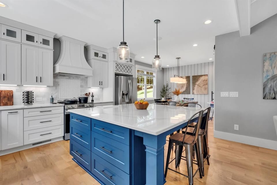 Spacious kitchen island with seating for four—perfect for meal prep, serving casual meals, morning coffee, or gathering while dinner simmers. A natural hub for connection and conversation.