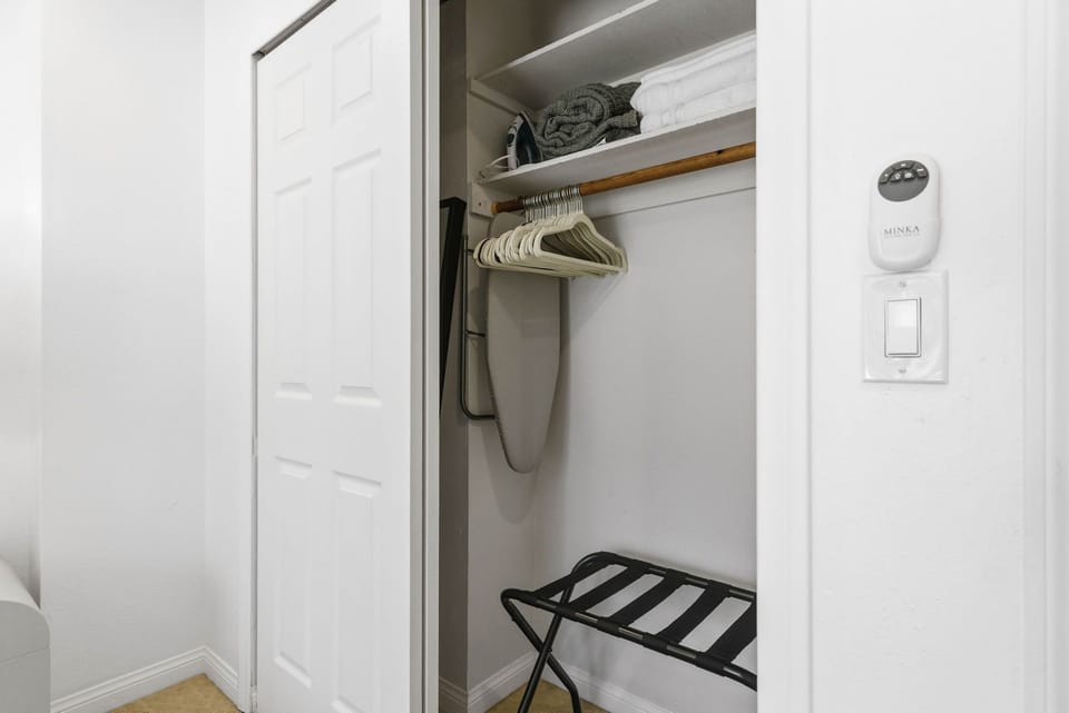 Extra hangers, ironing board, iron, and luggage tray included