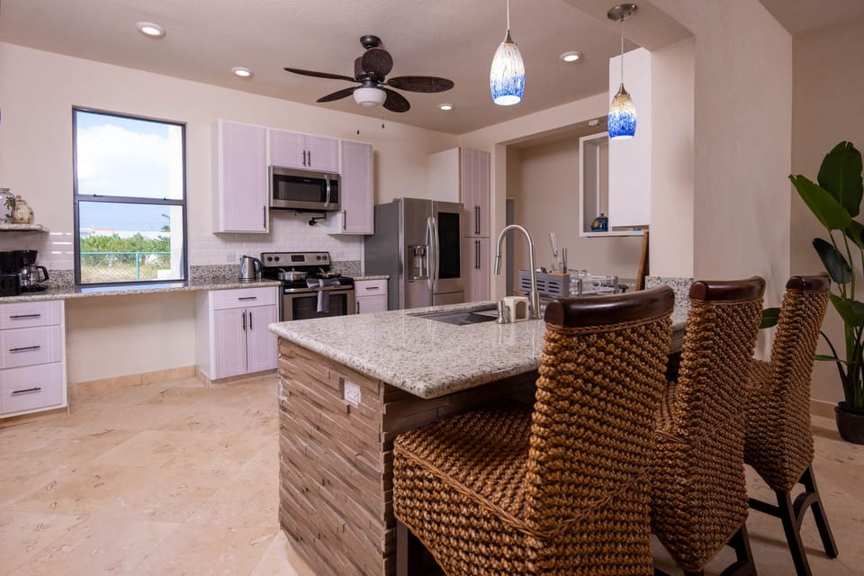 Large kitchen in the open space with access to the dining and living room area