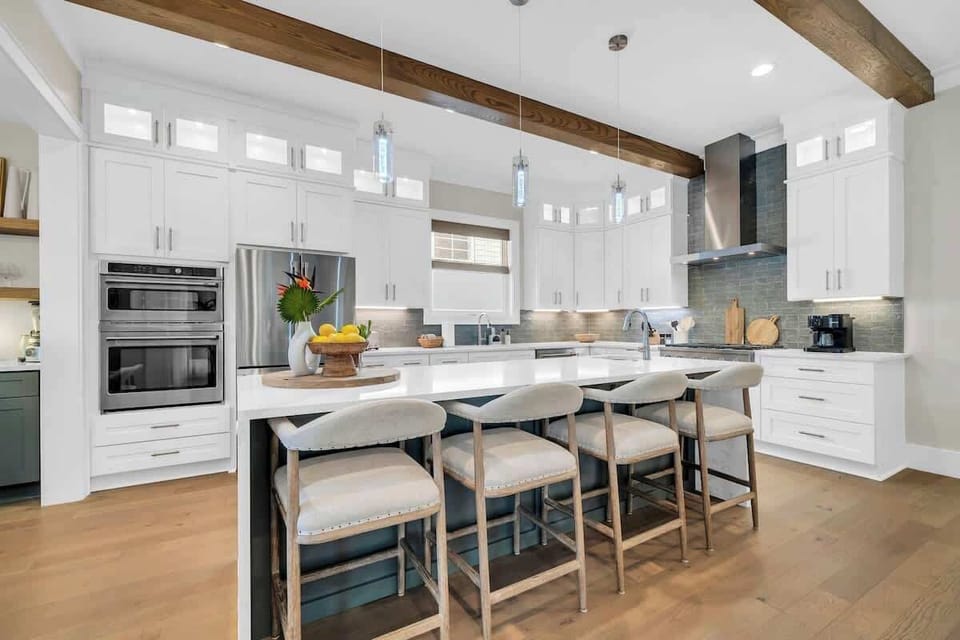 Fully stocked kitchen with large island equipped additional seating