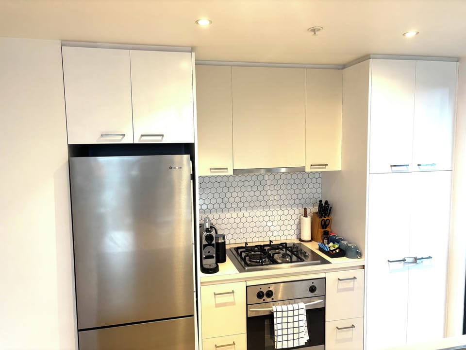 Kitchen with microwave and toaster inside the pantry