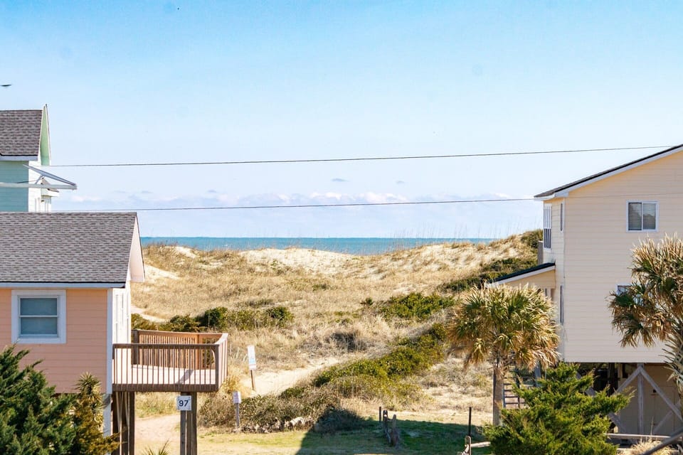 The top-level deck just off the queen ensuite bedroom offers partial ocean views and plenty of fresh air.