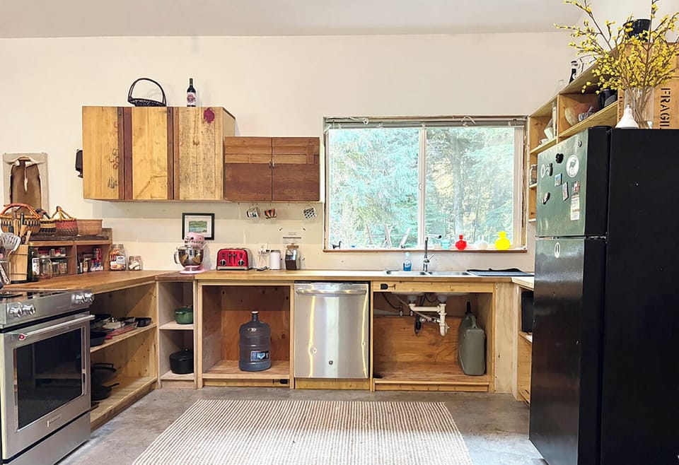 Forest views at the sink inspire serenity—dishwasher handles the rest.