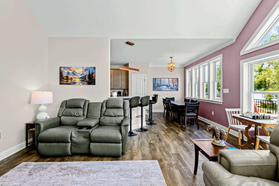 Living Room - Sectional seating opens onto the kitchen bar and dining area for easy conversation across the rooms.