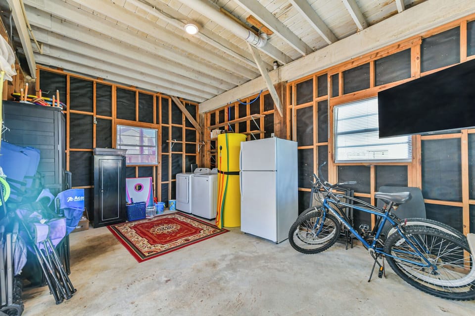 Downstairs washer, dryer, fridge, 2 bikes, and TV that can swing to the patio.
