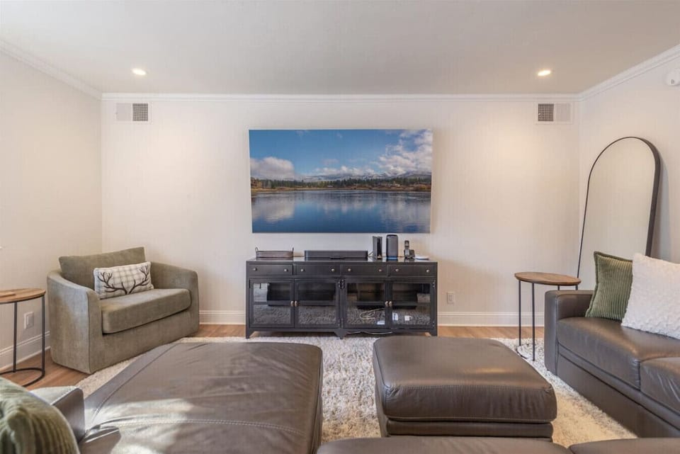 Nicely appointed living room with comfortable furnishings & large flat screen SmartTV.