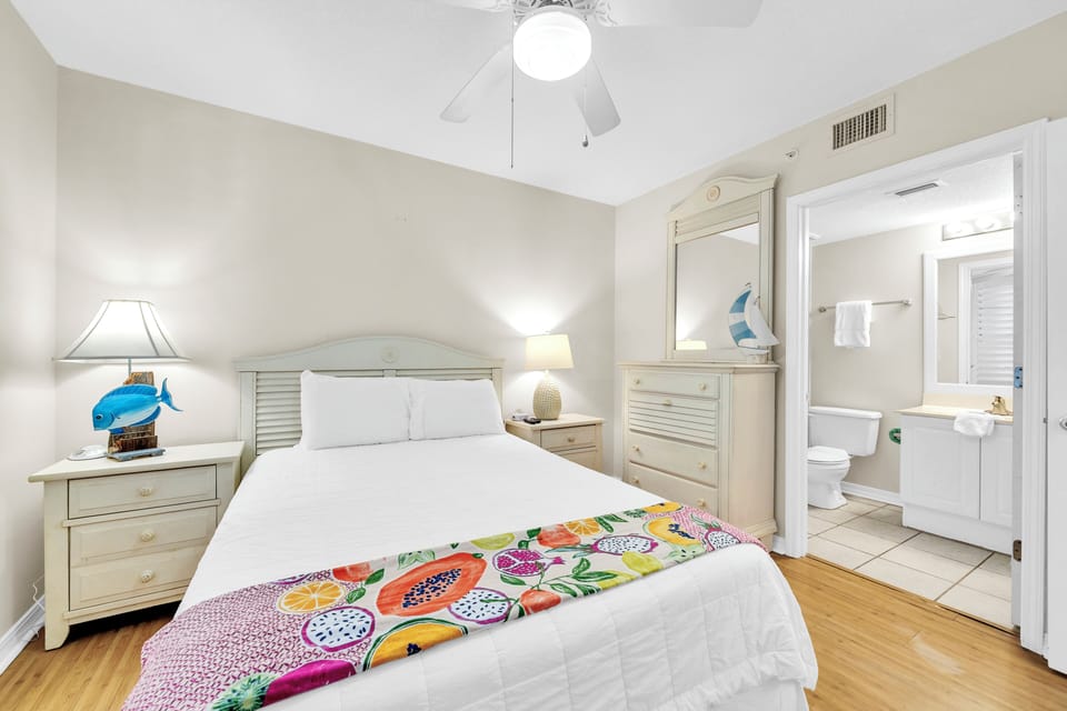 Unwind in your coastal bedroom with crisp linens, tropical decor, and your private ensuite bathroom steps away.