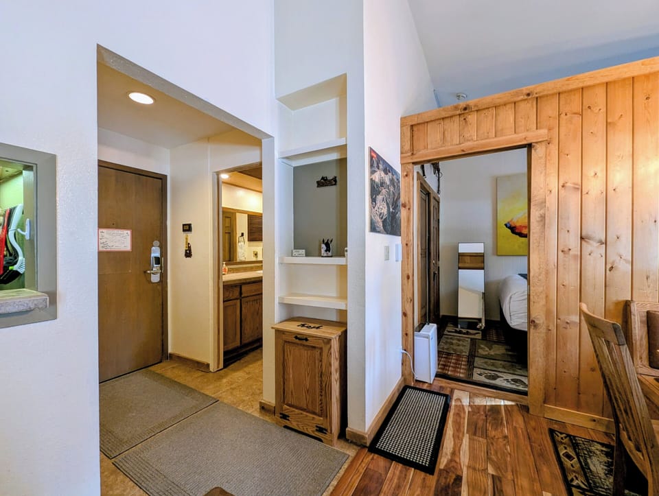 Step into your cozy mountain retreat with rustic wood details and thoughtful built-ins creating that perfect alpine lodge atmosphere.