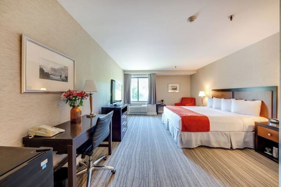 Stretch out in a spacious room with desk and lounge chair.