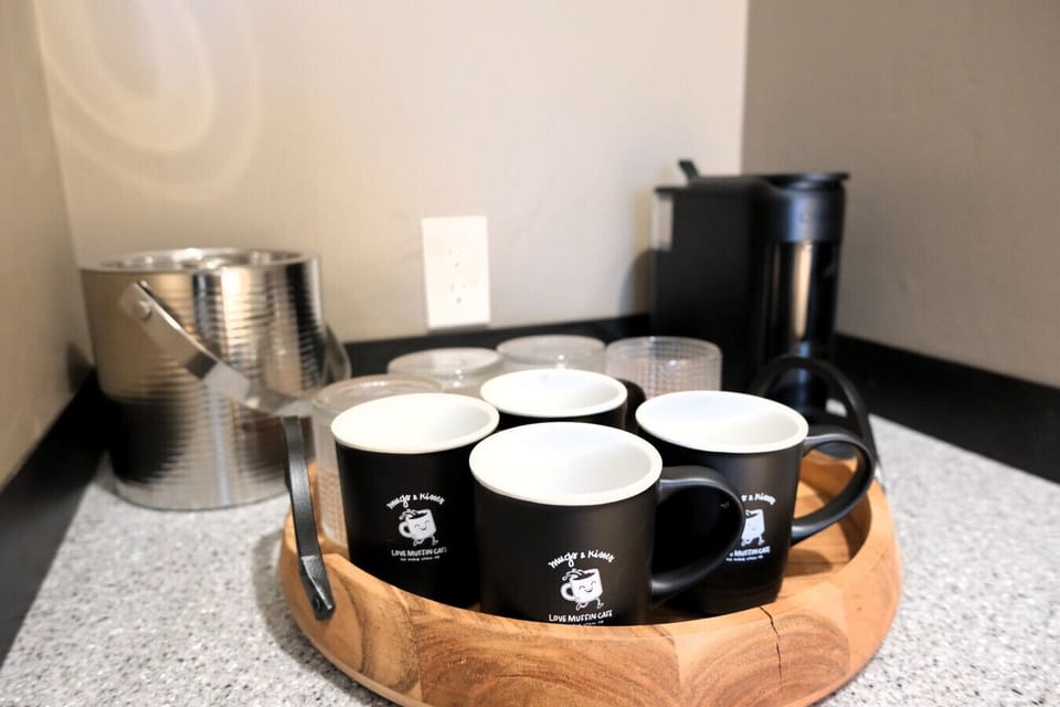 In-room coffee station and mini fridge—ideal for early park mornings or relaxing nights in your Moab getaway.