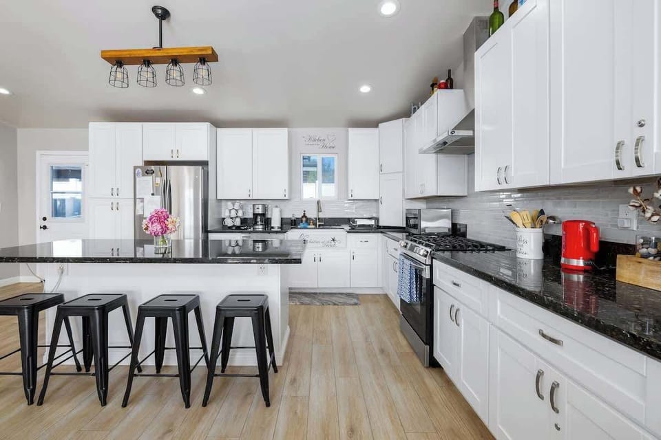 A bright, fully-equipped kitchen that makes cooking a joy. Enjoy modern appliances, ample space, and a breakfast bar for four!