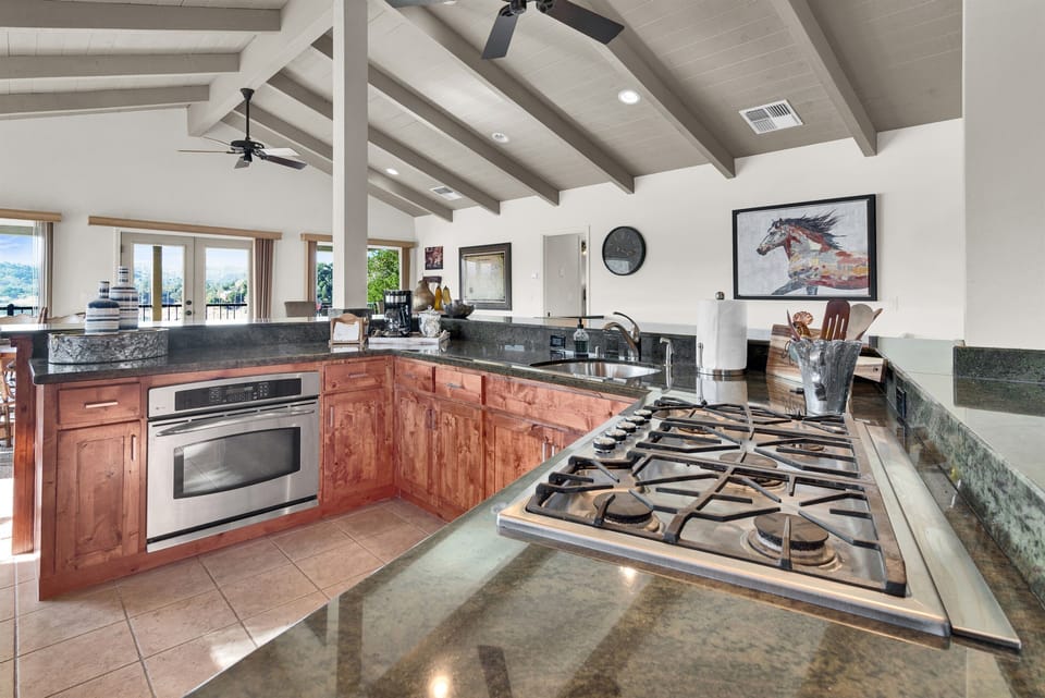 Fully stocked kitchen with cookware and serve ware