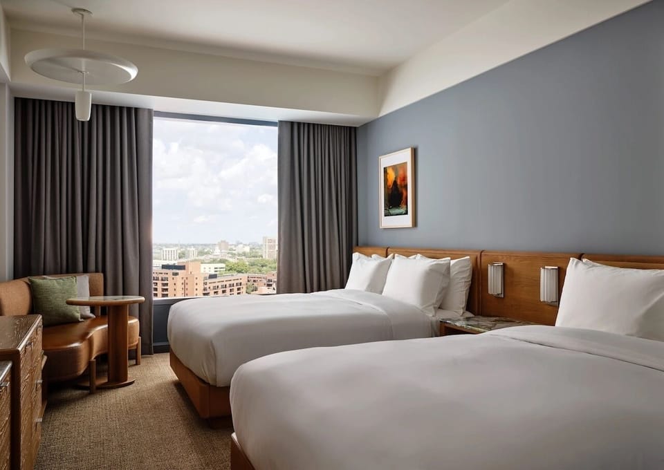 Wake up to skyline views from crisp, cloud-soft beds.