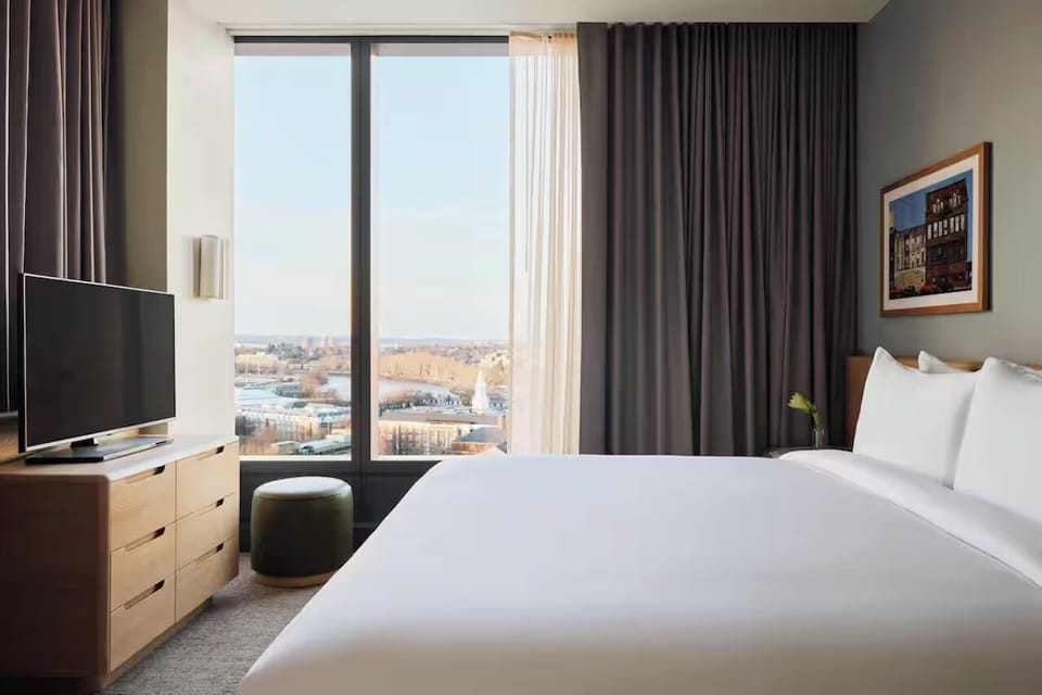 Unwind with a movie as sunlight pours through windows.