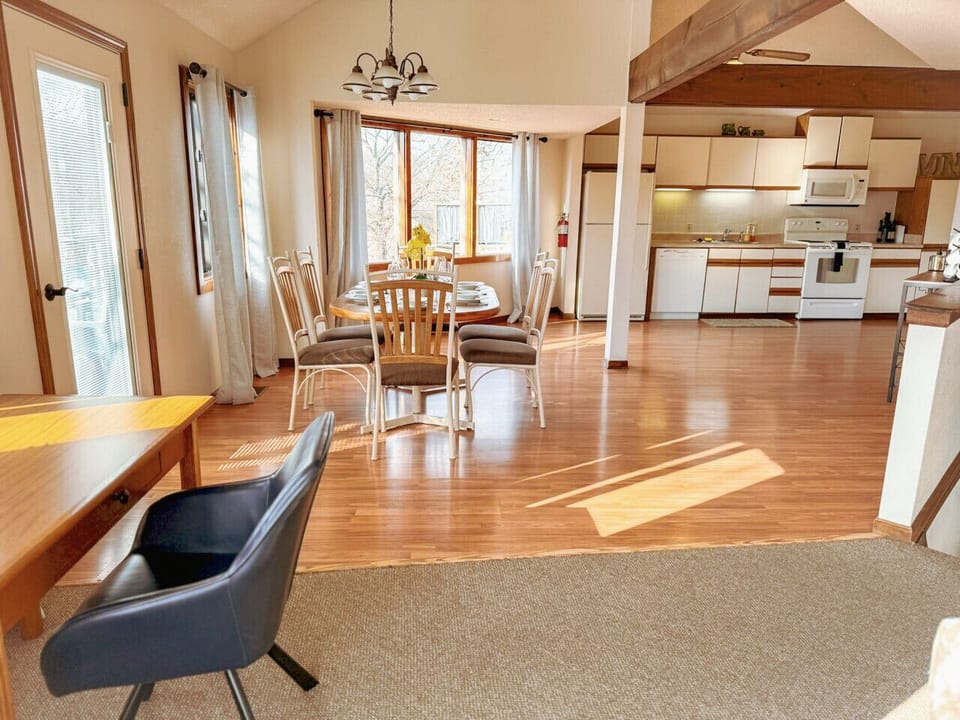Spacious open-concept kitchen and dining area with abundant natural light and seating for gatherings—perfect for entertaining and comfortable extended stays.